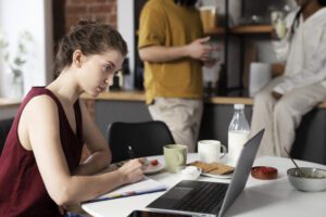 side-view-woman-working-laptop