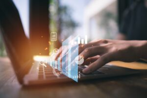 midsection-person-holding-smart-phone-table