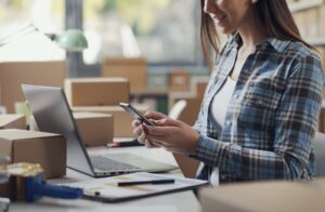 E-commerce specialist using a smartphone
