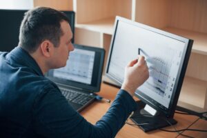 Putting attention for every moment. Polygraph examiner works in the office with his lie detector’s equipment